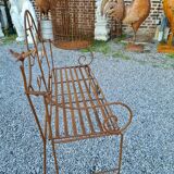 Wrought iron garden bench with birds