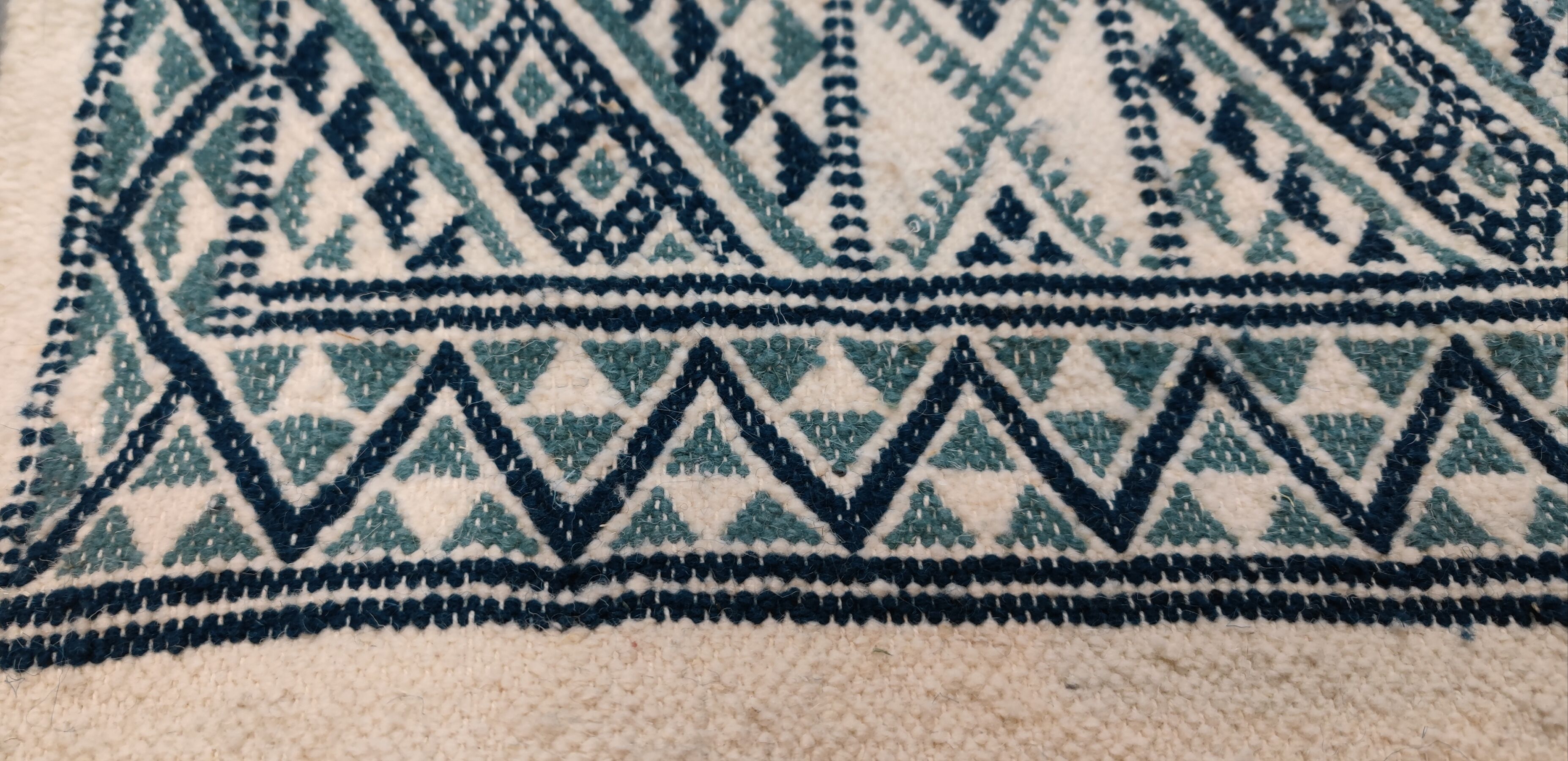 Handmade traditional white and blue carpet, 152x76 cm