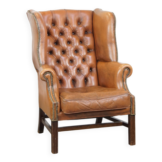 Classic, light cognac-colored cowhide leather English Chesterfield armchair
