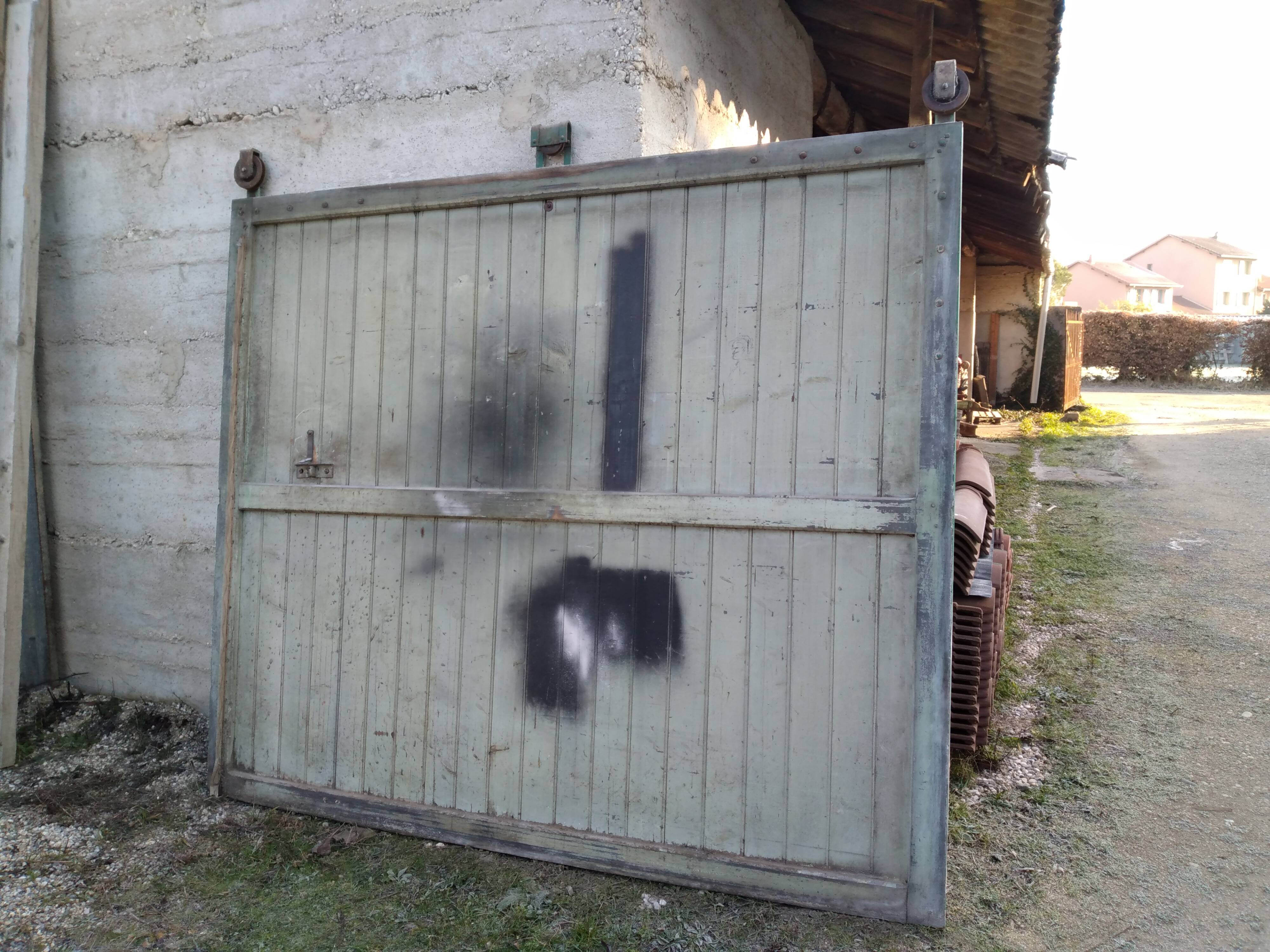 Old wooden door with pulley