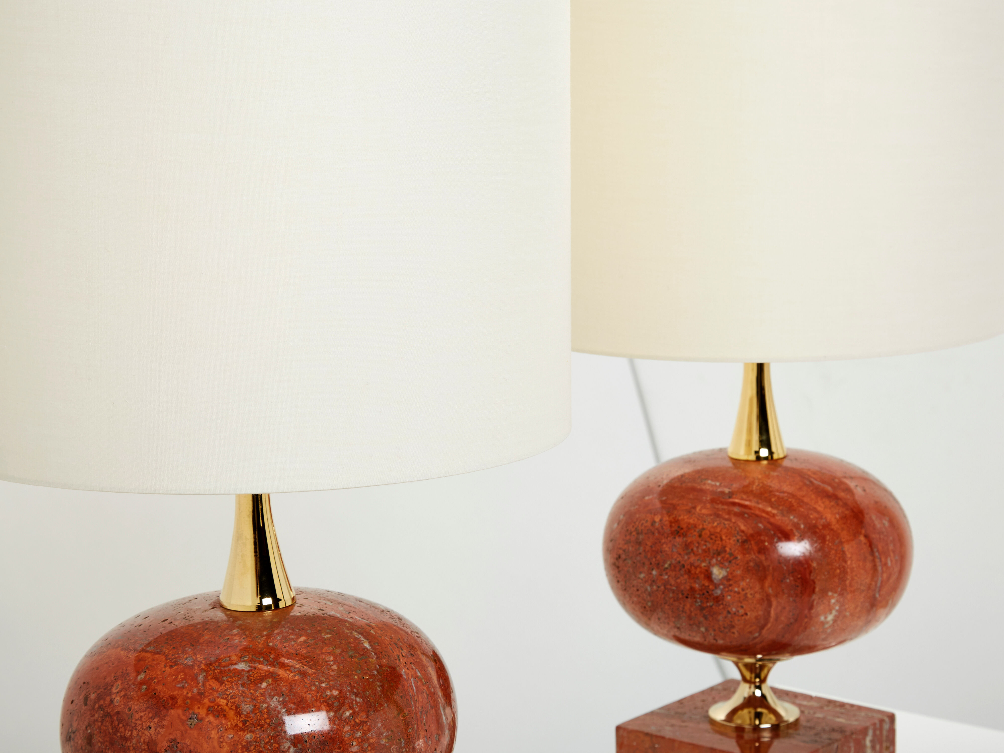 Pair of lamps in red travertine and brass 1970