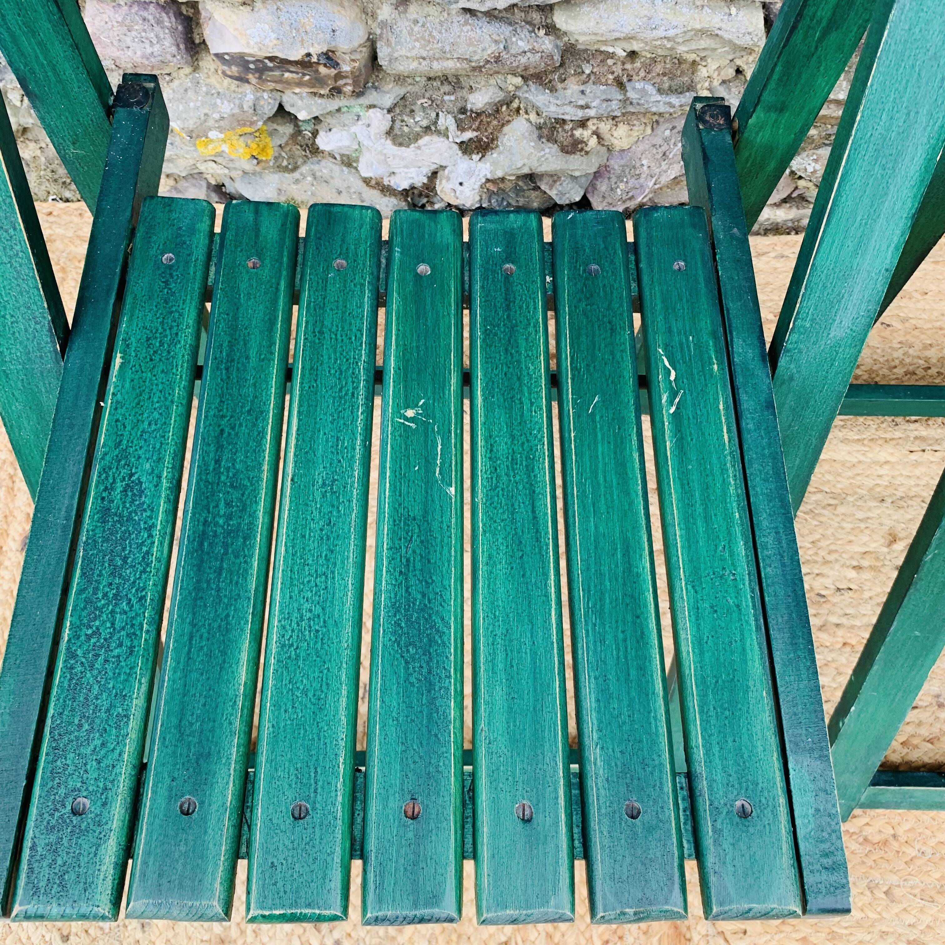 Set of 4 green folding chairs