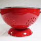 Colander on foot in red enamelled metal