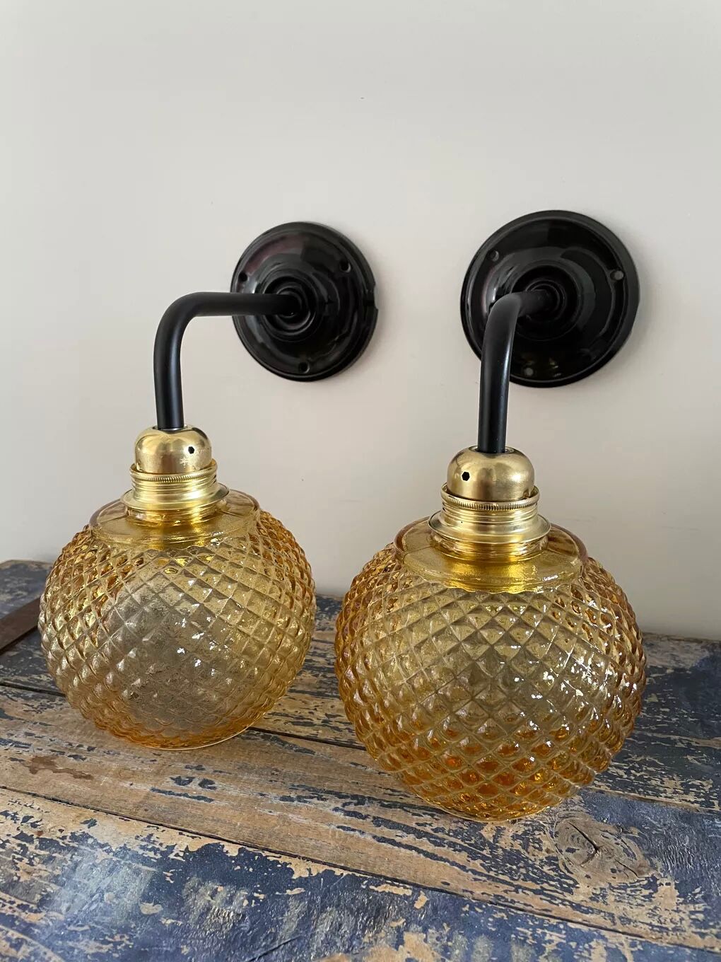 Pair of vintage sconces in electrified golden glass to nine