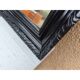Black lacquered wood mirror "originally punctured"