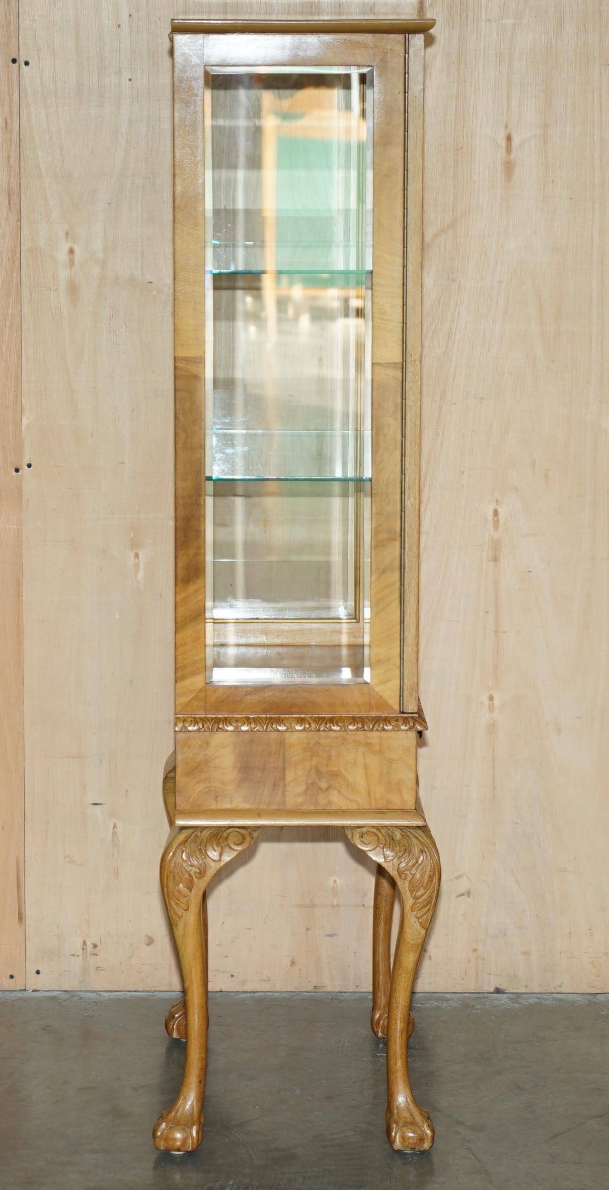Pair of Art Deco display cabinets circa 1920 in light walnut with Cabriolet legs.