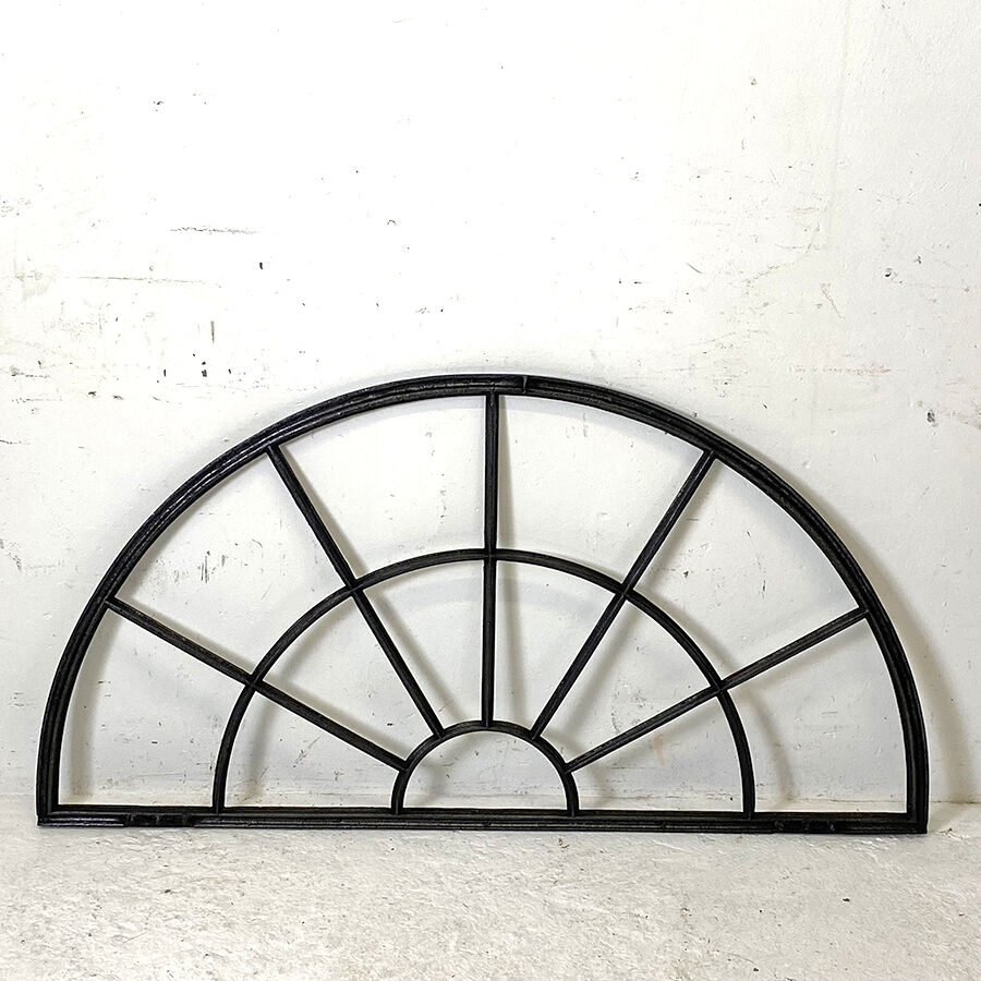 Old arched anthracite grey window