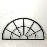 Old arched anthracite grey window