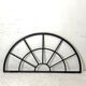 Old arched anthracite grey window
