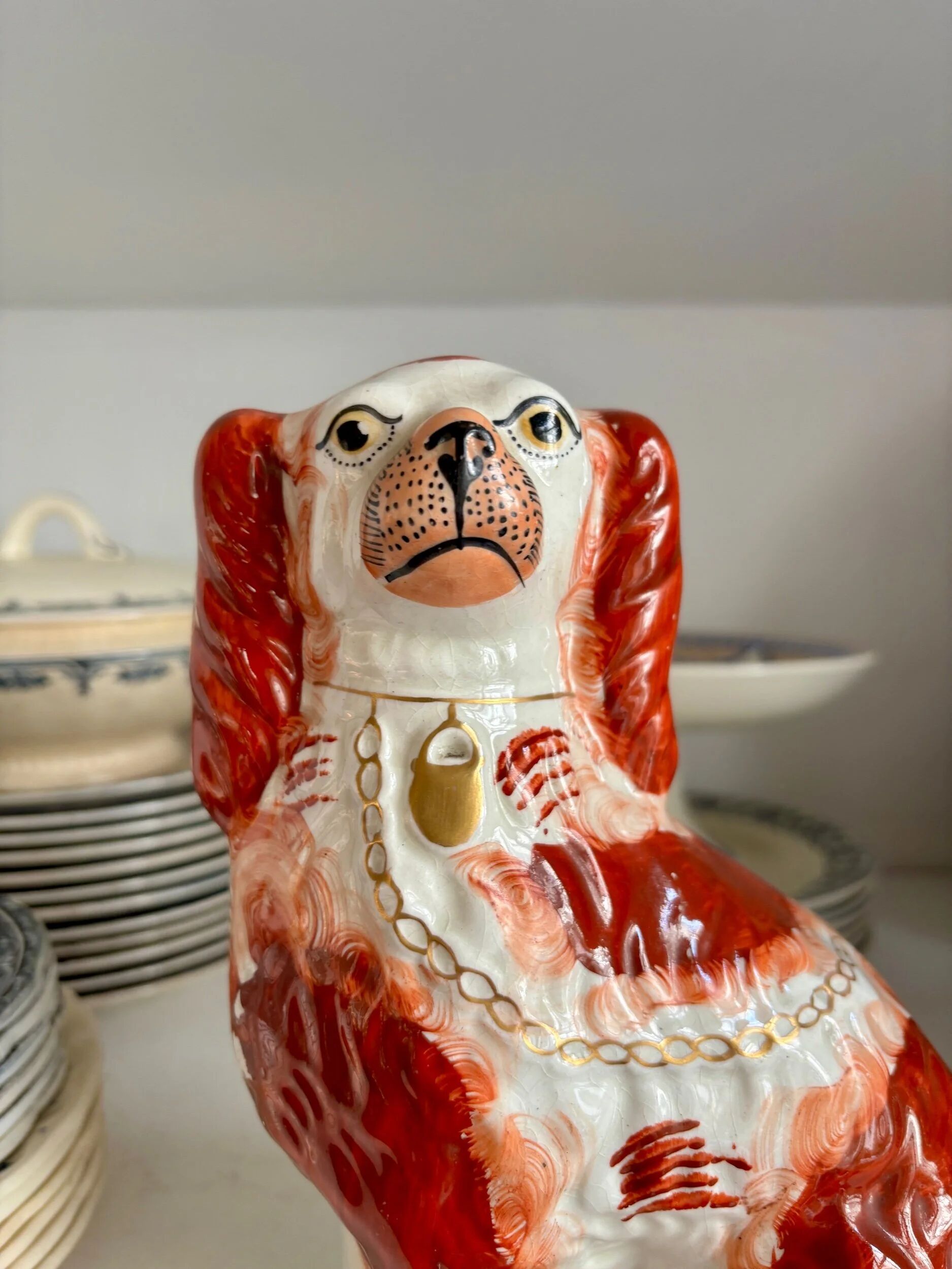 Staffordshire porcelain King Charles Cavalier dog in red, number 1, 19th century.