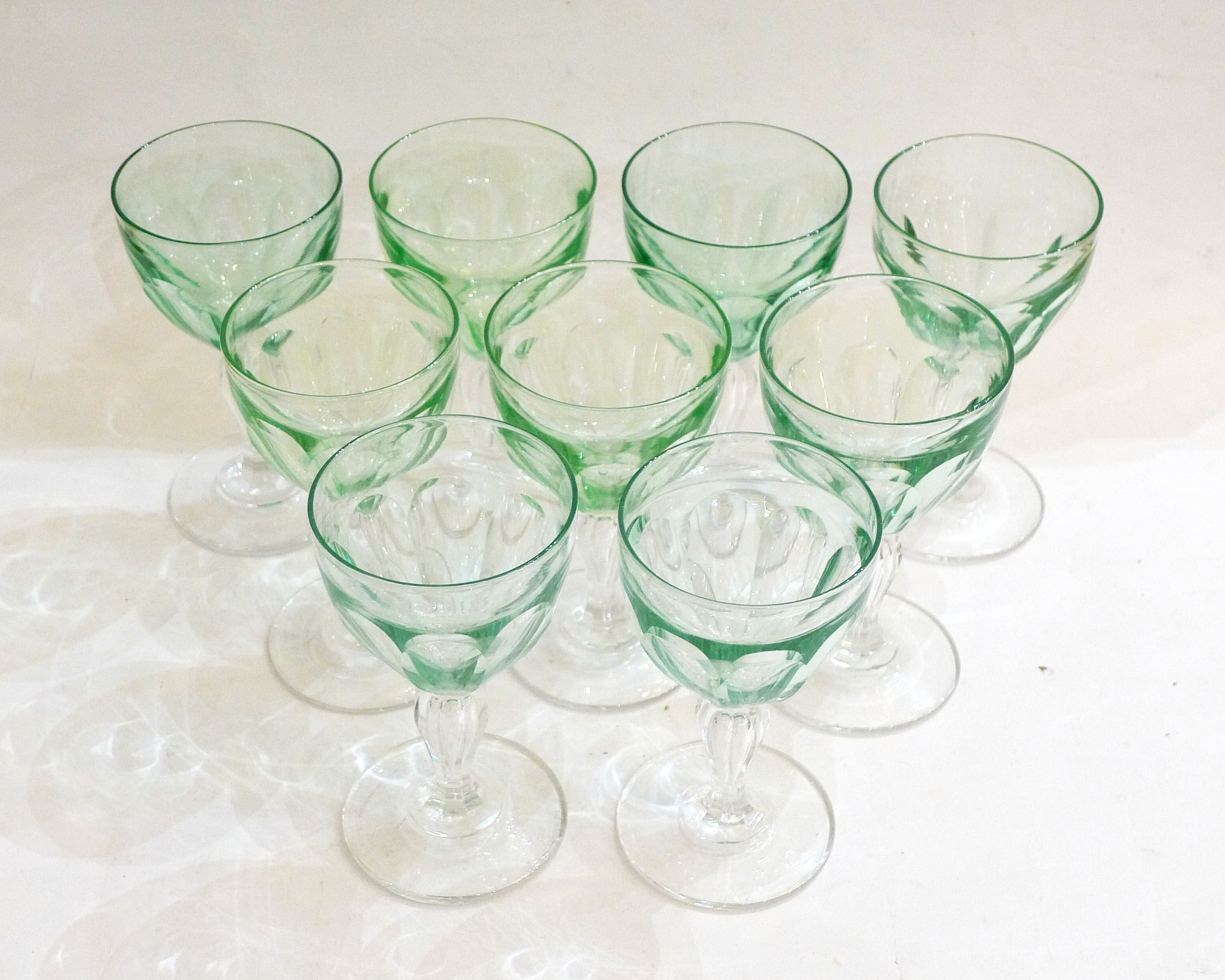 Set of nine glasses on foot in cut glass