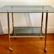 Smoked glass and gilded brass trolley