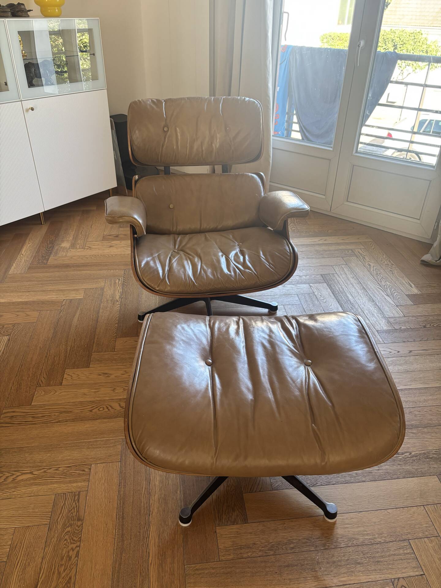 Armchairs and footrests by Charles & Ray Eames