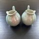 Pair of iridescent blue pitchers