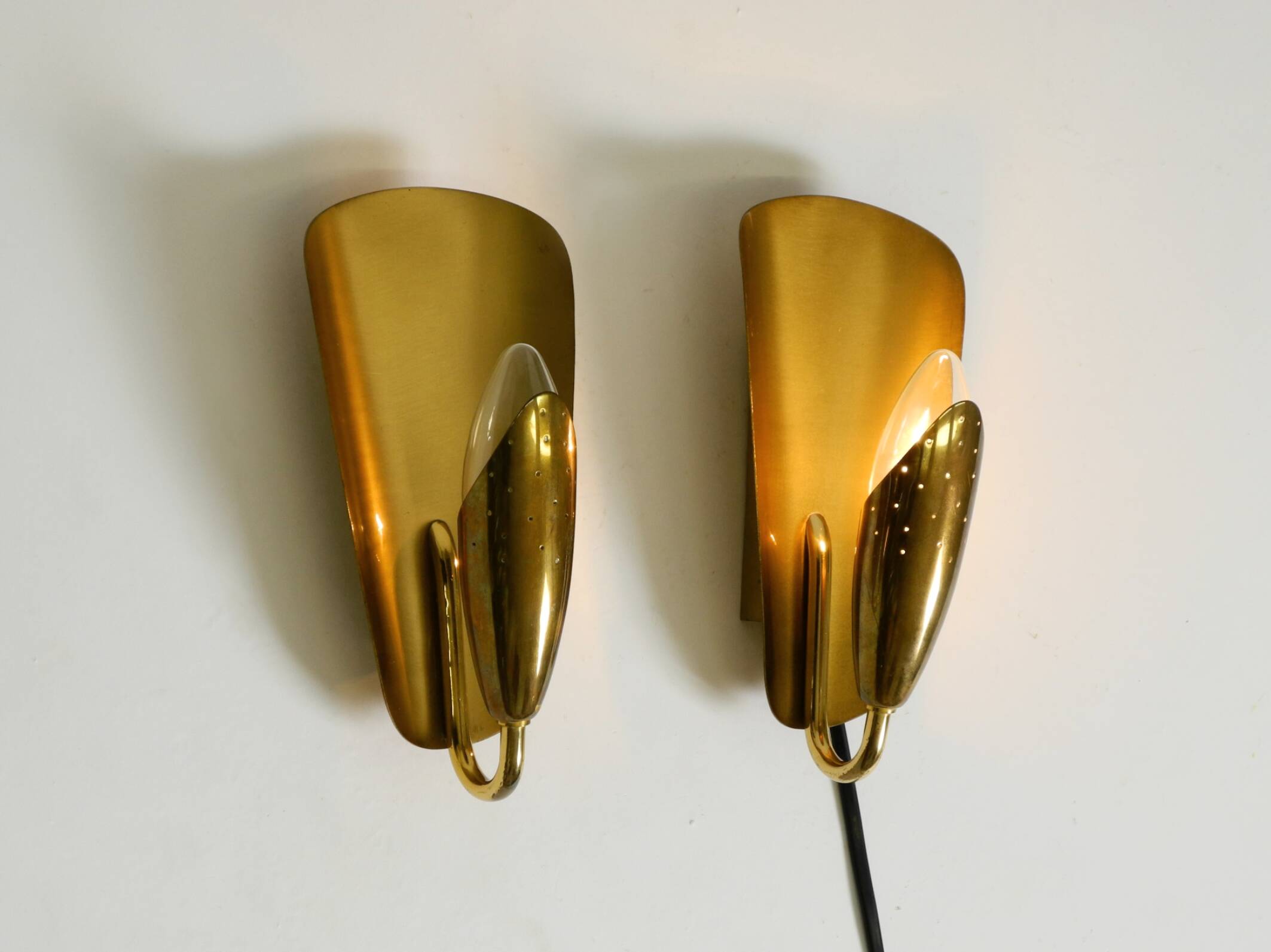Two enchanting original Swedish Mid Century Modern brass wall lamps