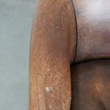 Sturdy vintage sheepskin club armchair with a beautiful patina