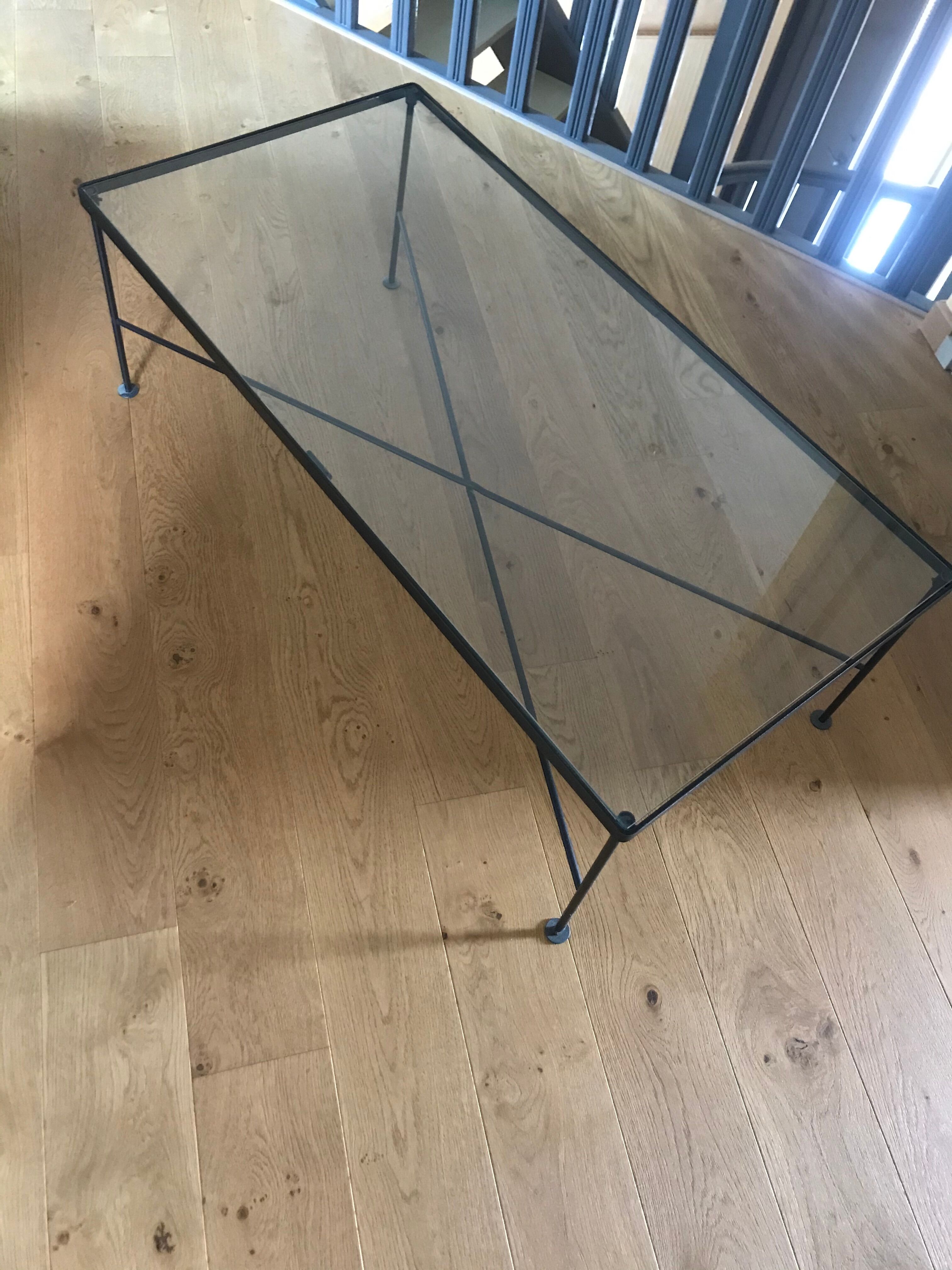 Glass and black metal coffee table