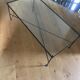 Glass and black metal coffee table