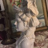 Bust of a woman with a hat