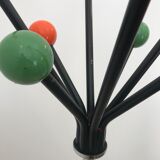 Wearing chrome parrot coat, black and multicolored balls