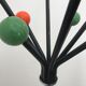 Wearing chrome parrot coat, black and multicolored balls