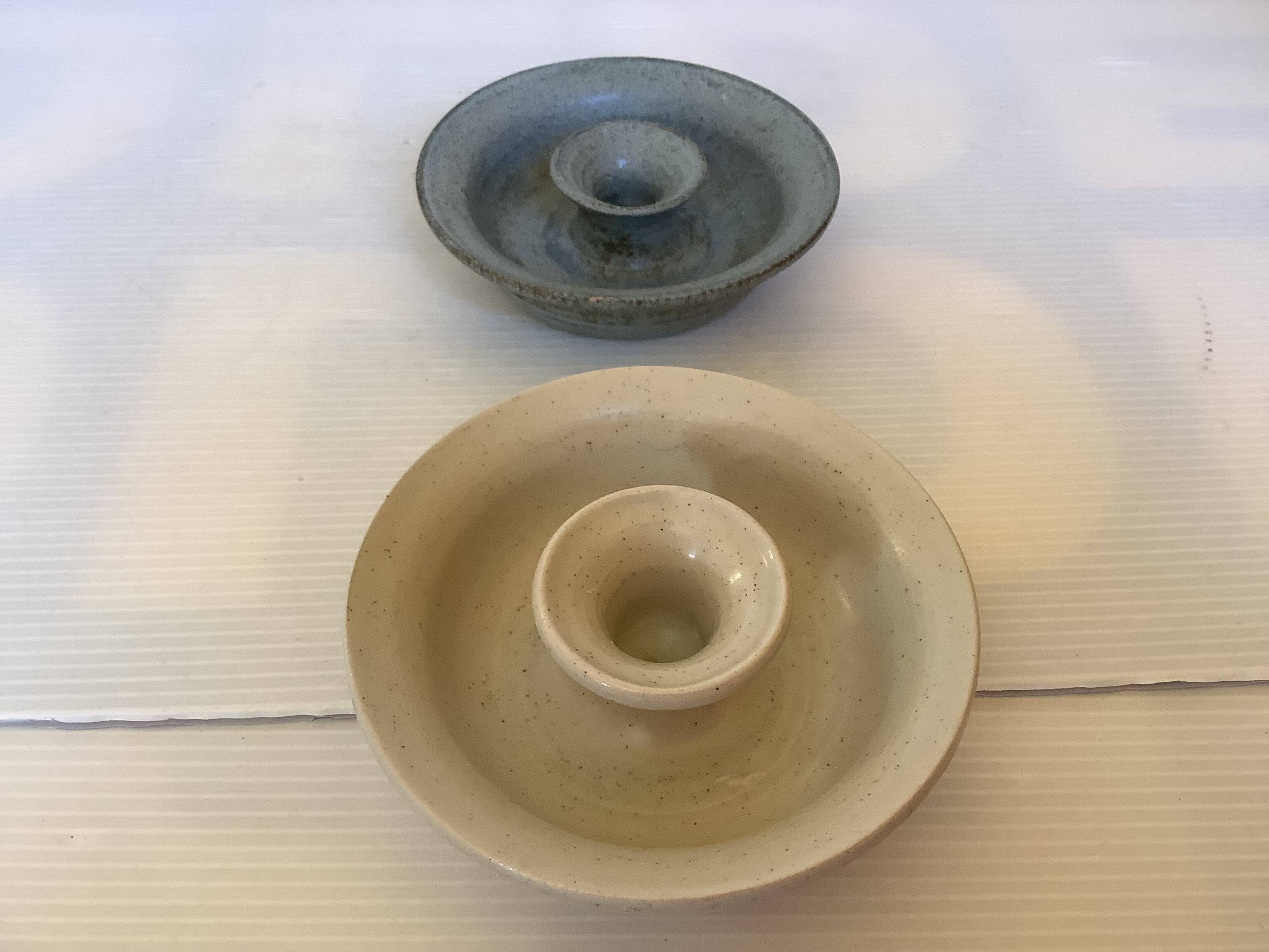 Pair of beige and blue ceramic candlesticks