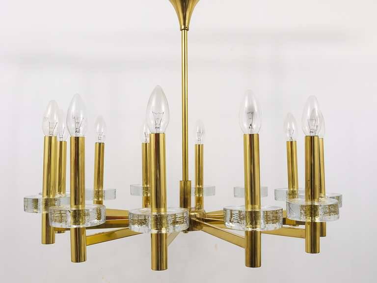Brass and glass disc pendant light in the style of Gaetano Sciolari, mid-century, Italy, 1970s.