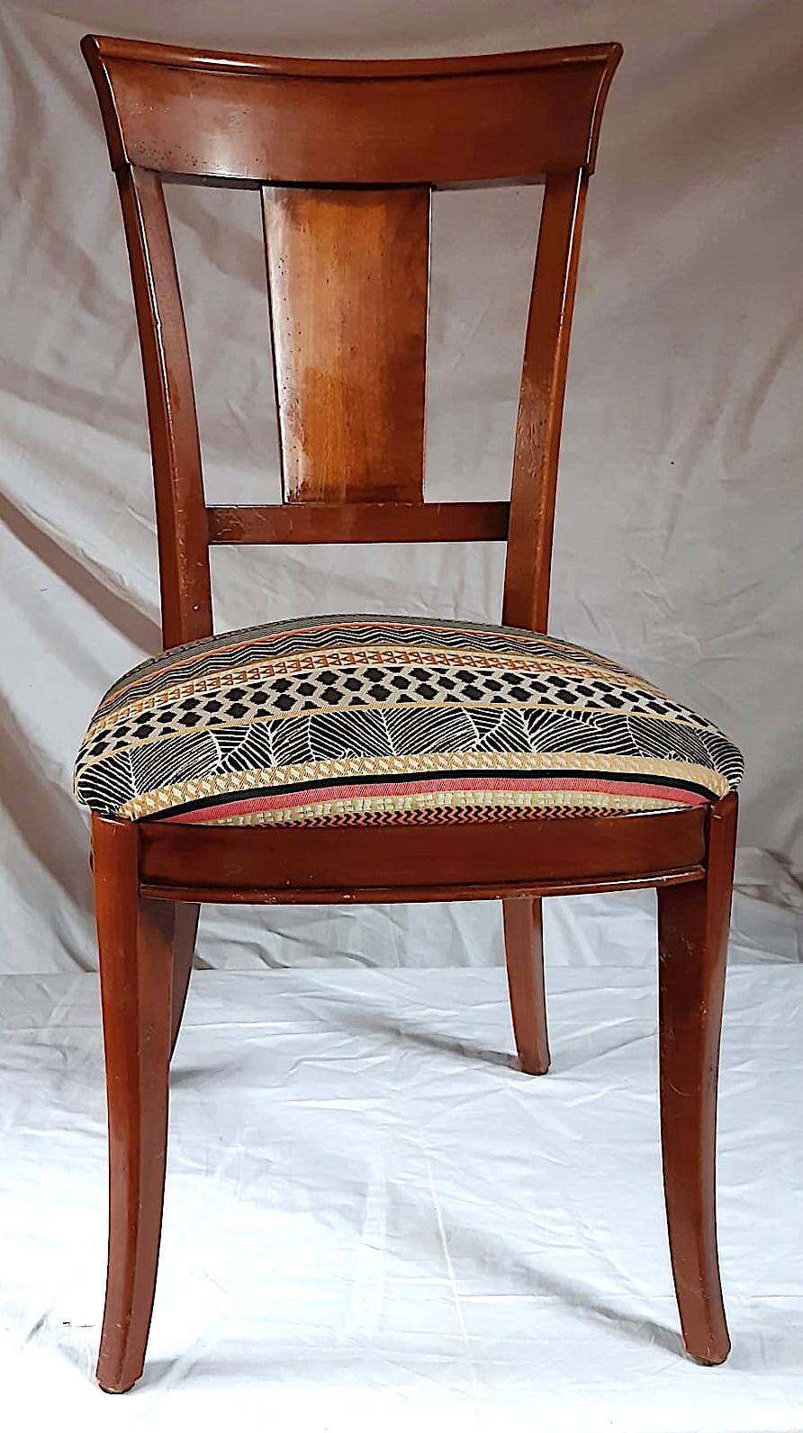 2 varnished solid wood chairs with "ethnic" padding