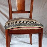 2 varnished solid wood chairs with "ethnic" padding