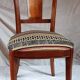 2 varnished solid wood chairs with "ethnic" padding