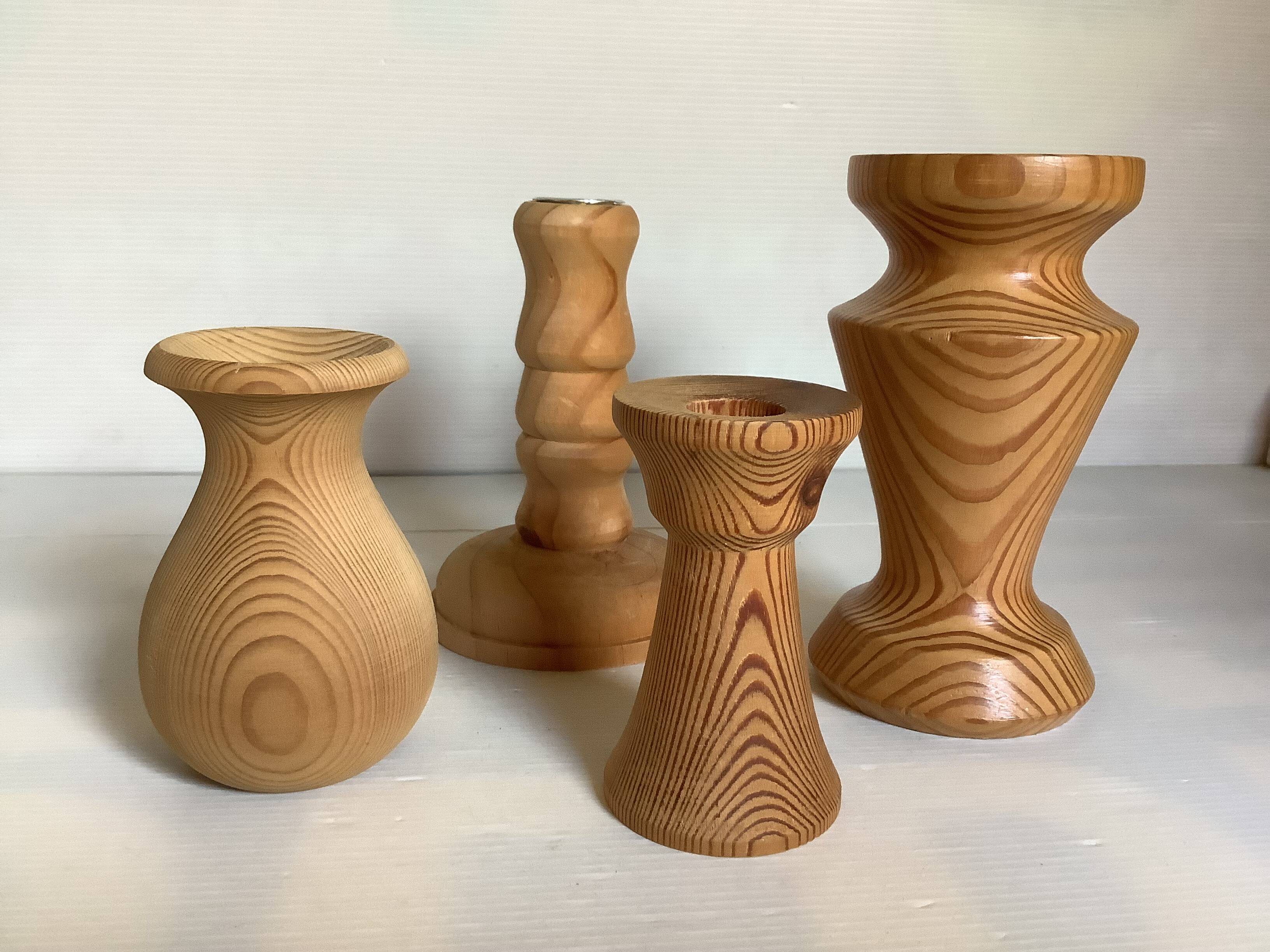 Four wooden vases and candlesticks