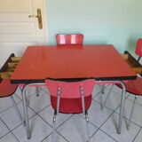 Table in red formica, 4 roc chairs, 2 extension cords, 2 drawers 60