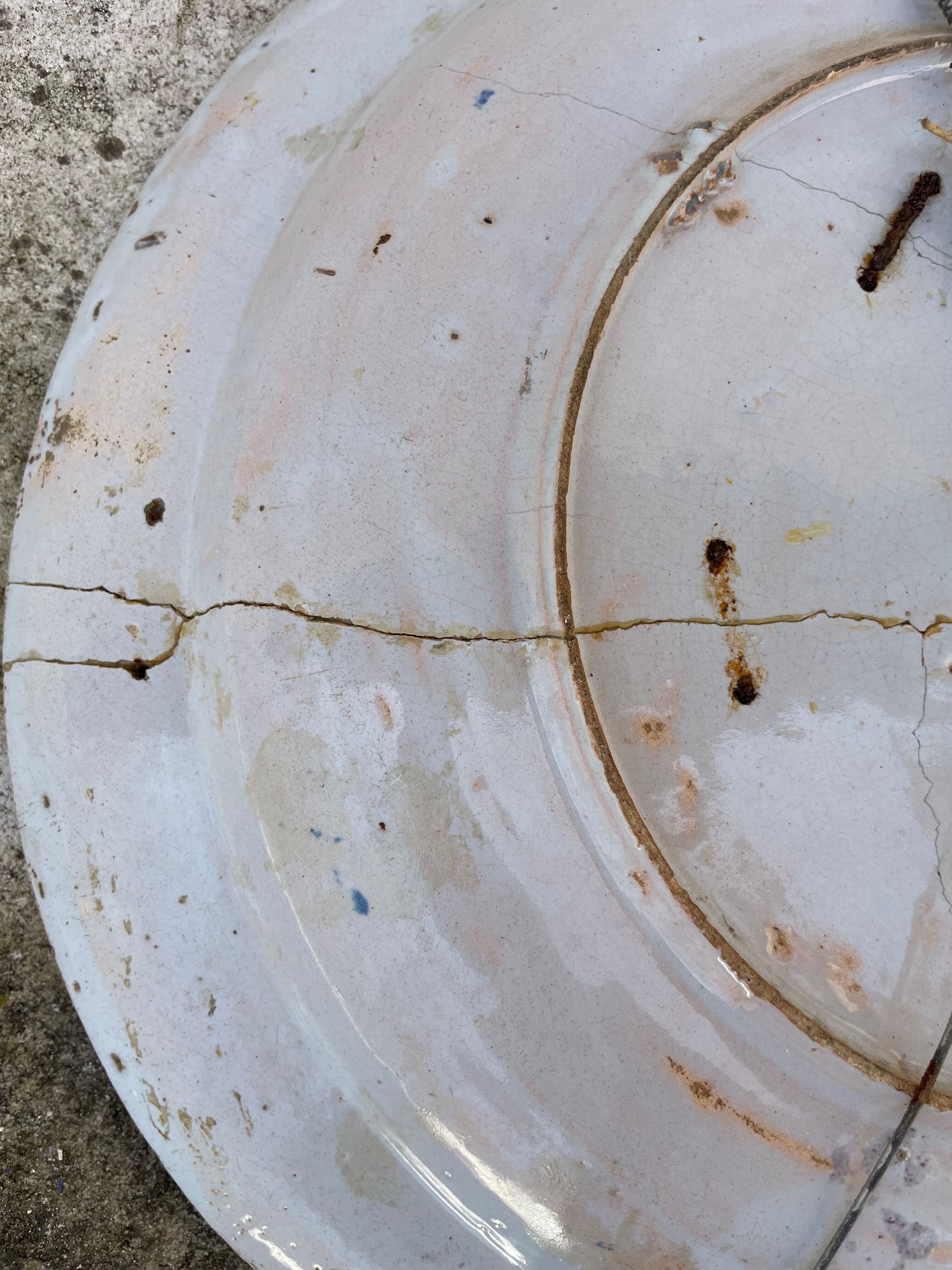 Restored antique dish with floral motif