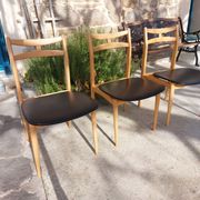 3 Scandinavian style chairs, light wood and black faux leather.