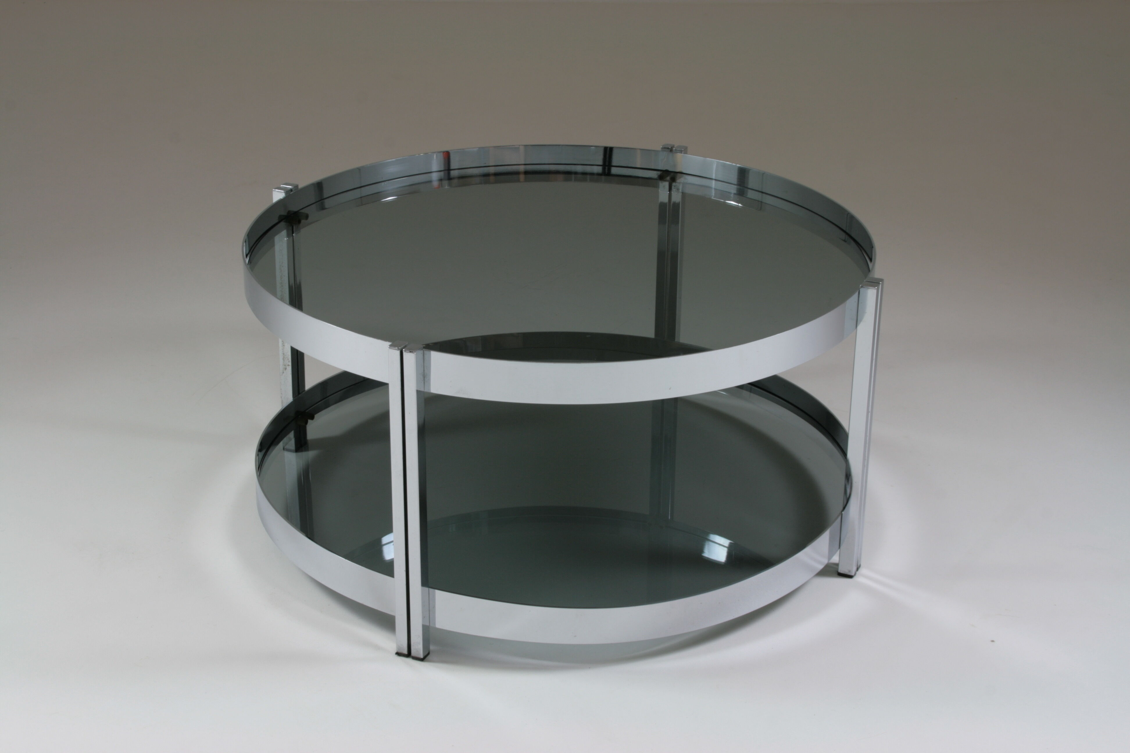 Round chrome-plated metal coffee table and smoked glass tops, France 1970s