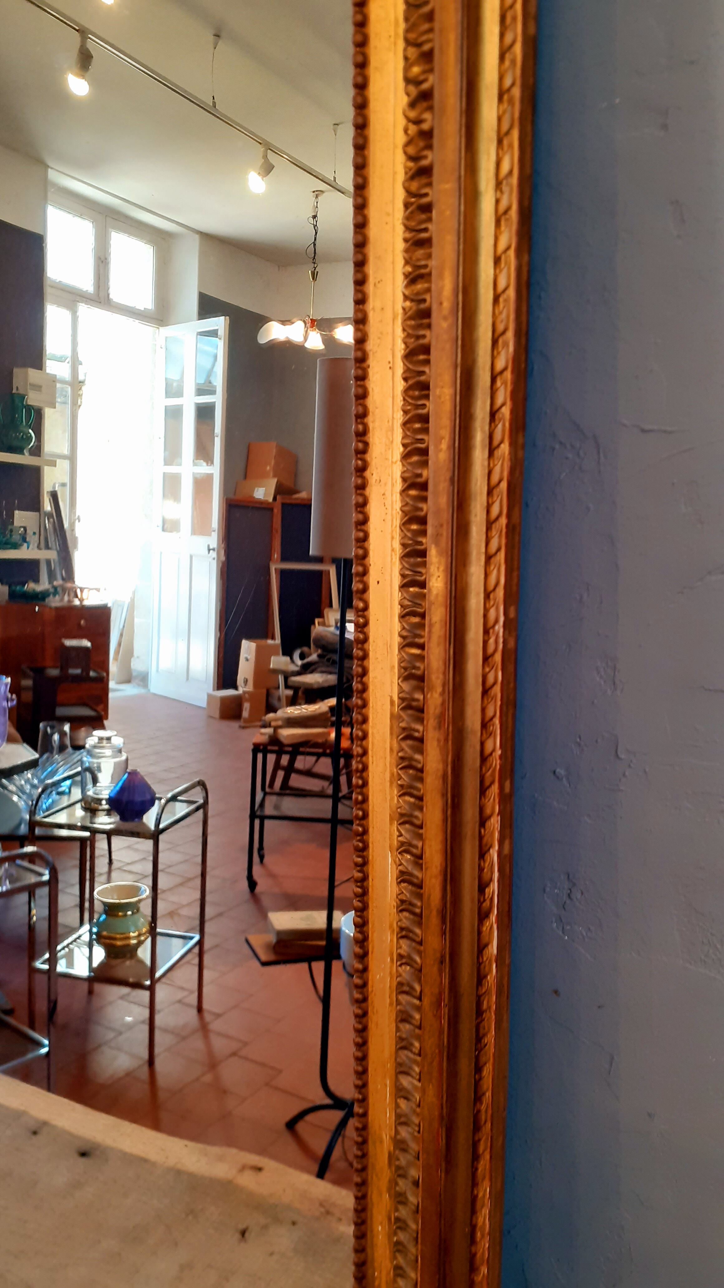 Large mirror XIX th in wood and gilded stucco Louis XVI style