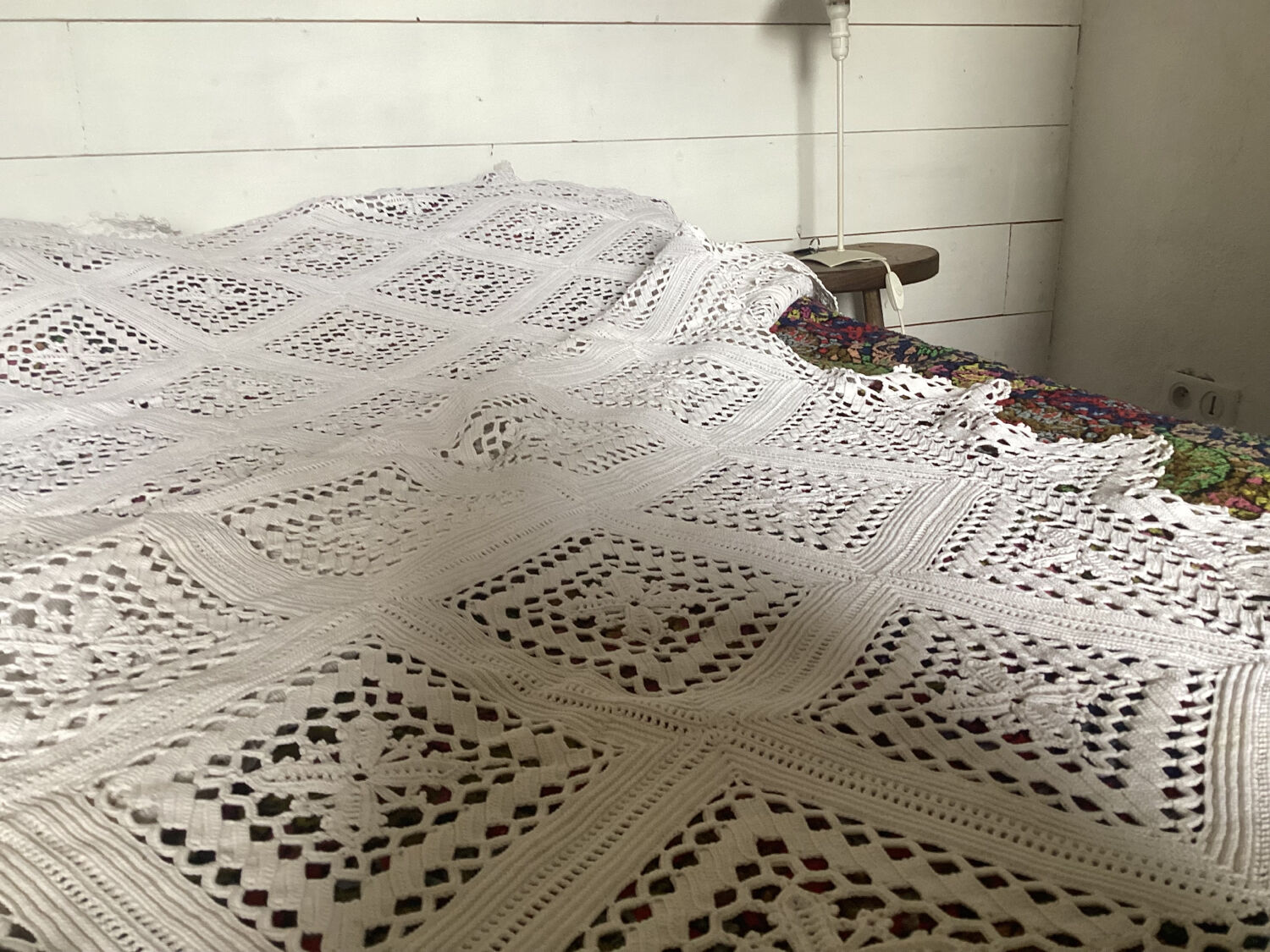 White cotton crochet bedspread with diamonds