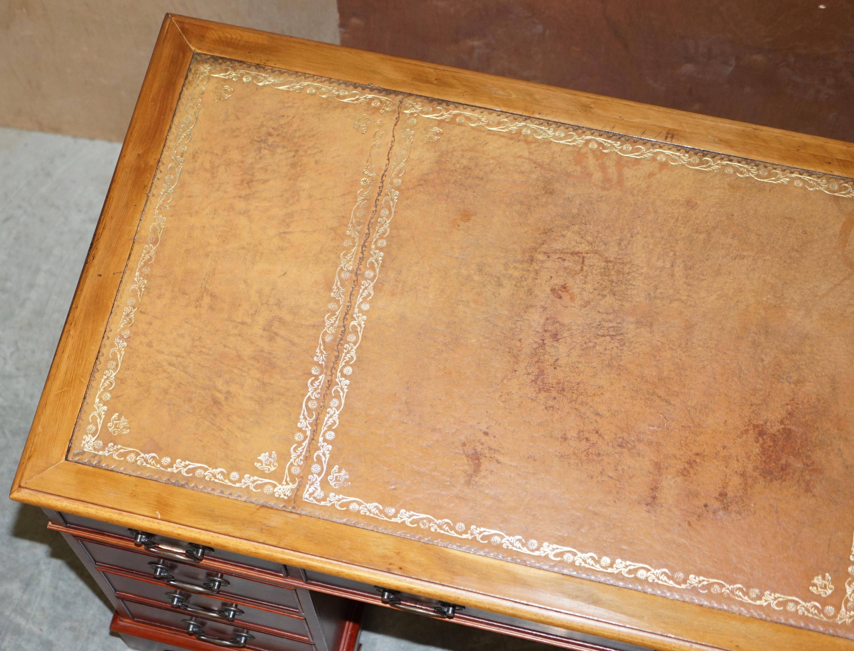 Vintage walnut desk with a leather top and two drawers.