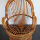 Fauteuil rotin pivotant