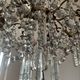 Grand chandelier in Louis XV style with crystal pendants.