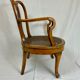 Fauteuil bas anglais en bois ajouré à assise cannée, 19e siècle