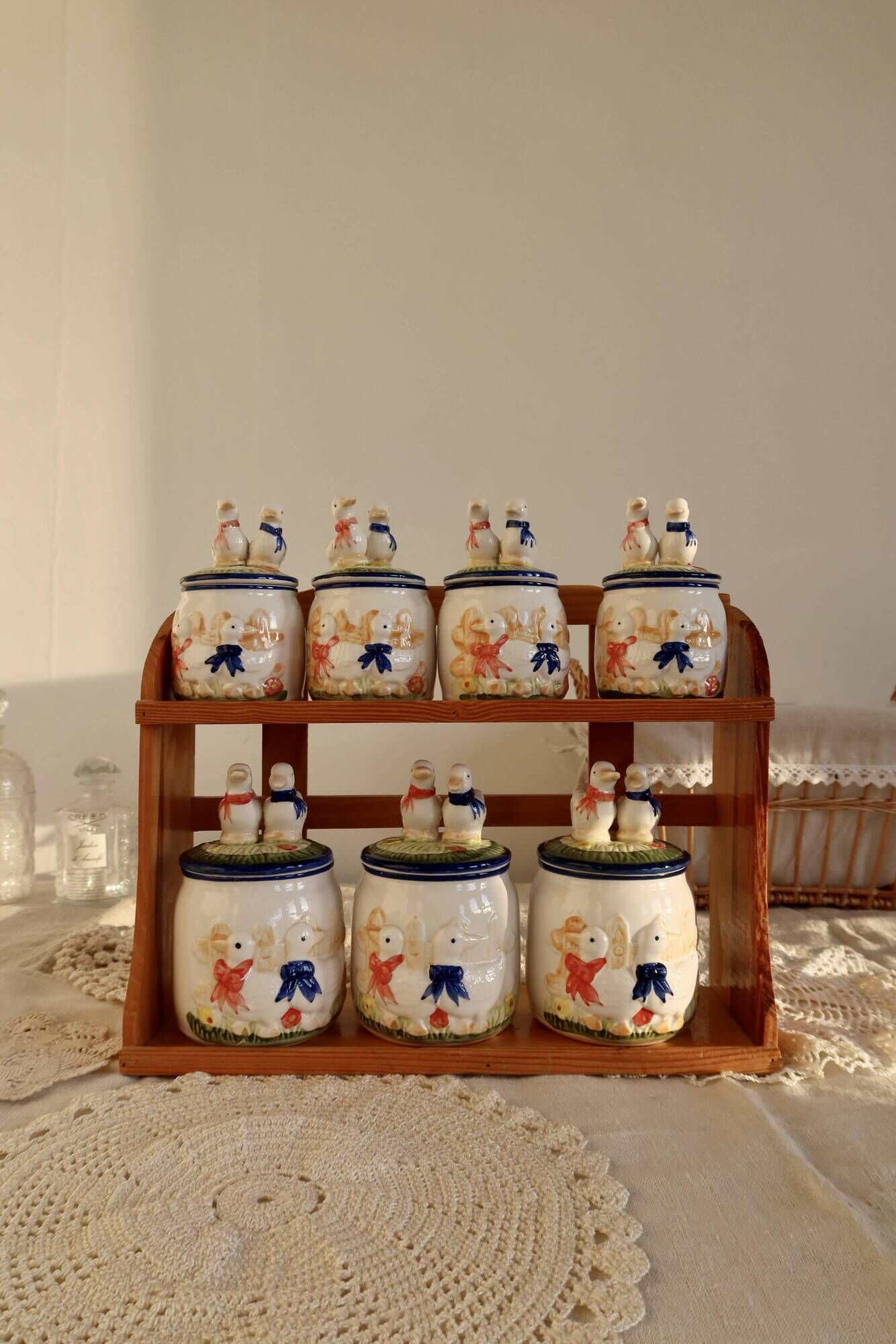 Vintage wooden wall condiment shelf and porcelain pots with geese slip pattern