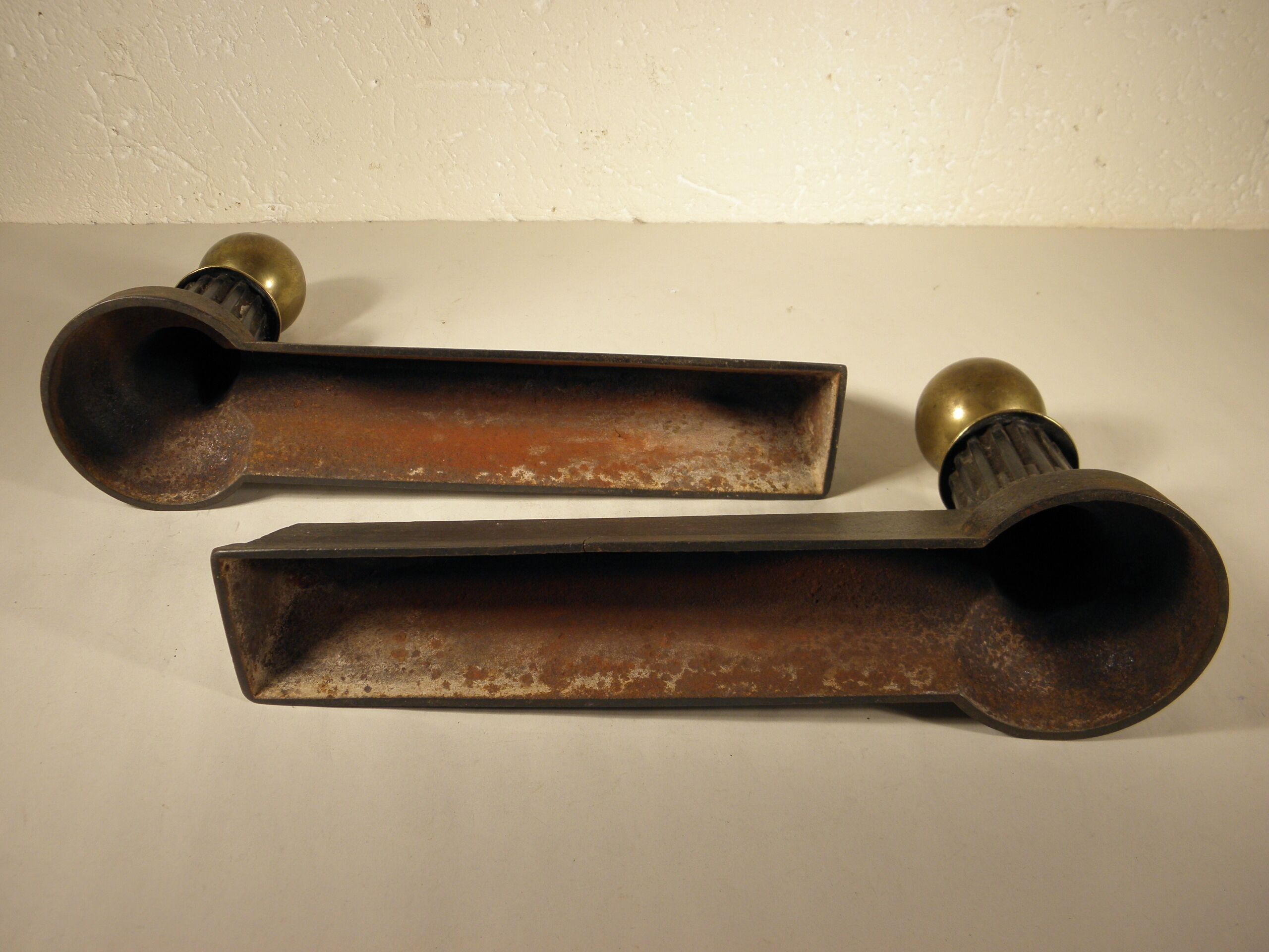 Pair of cast iron and brass chenets