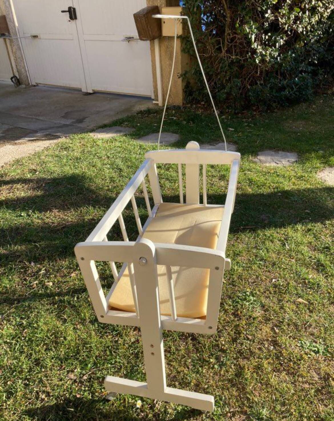 Complete wooden doll cradle on wheels