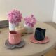 Set of ceramic artisan mugs with blue-grey pop water lily design.