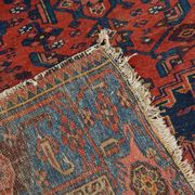 Antique hand-knotted oriental rug with predominantly red, purple, and blue colors 182x136cm