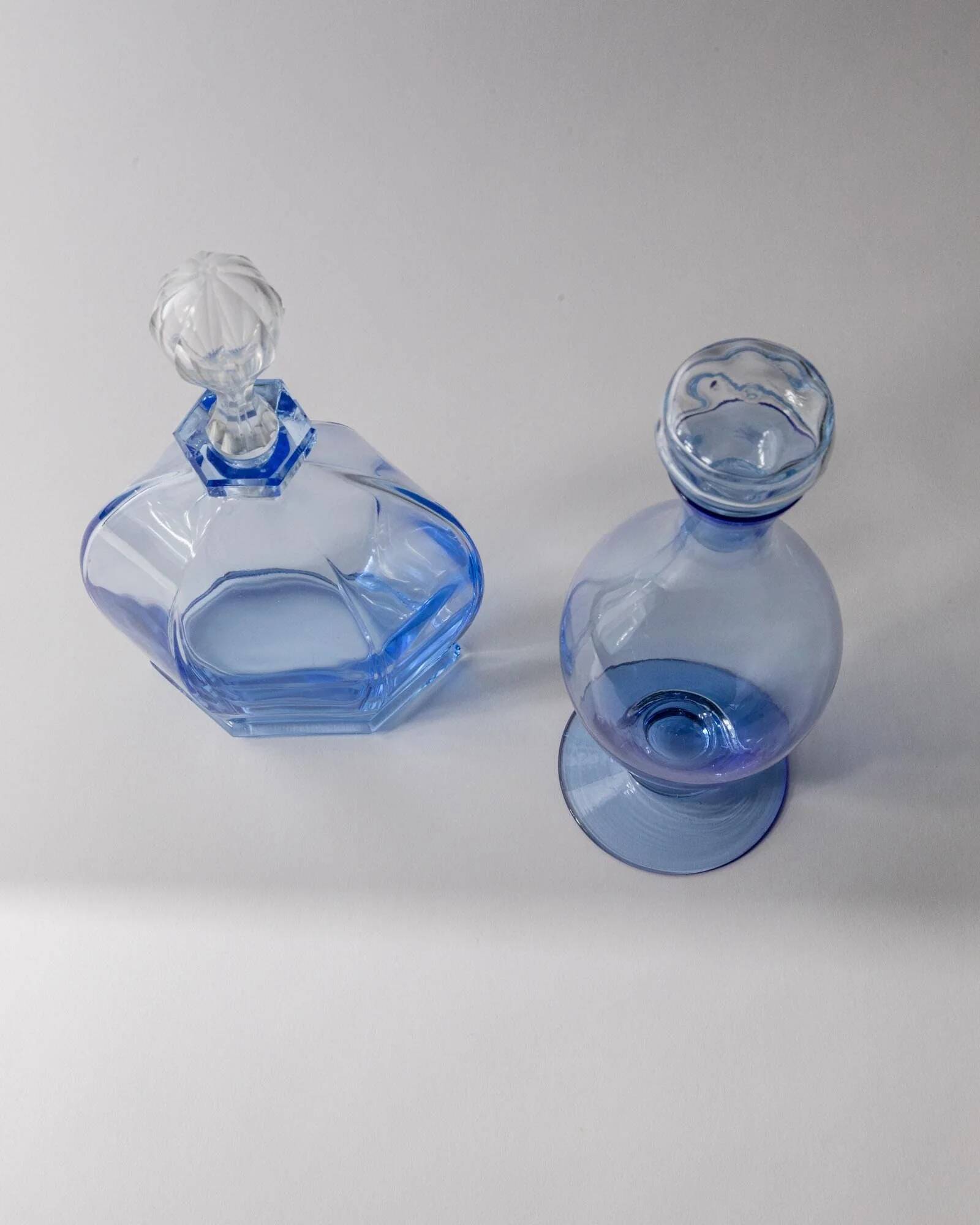 Set of 2 vintage Murano glass carafes from the 1940s, blue art glass with stoppers.