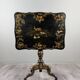 Table pliante Napoléon III en bois laqué noir et décor doré, XIXe siècle
