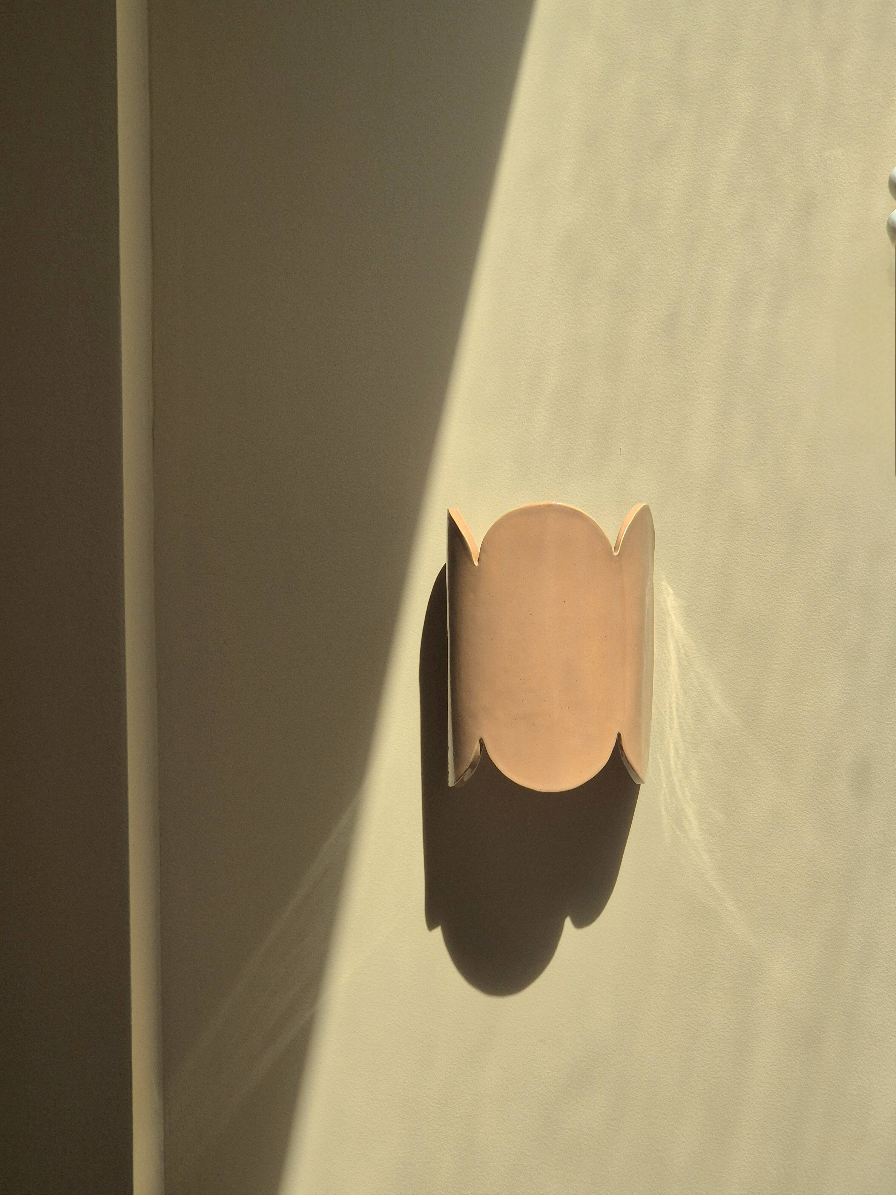 Mocha enamelled stoneware wall light (small model).