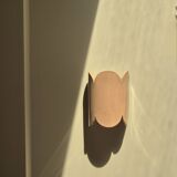 Mocha enamelled stoneware wall light (small model).